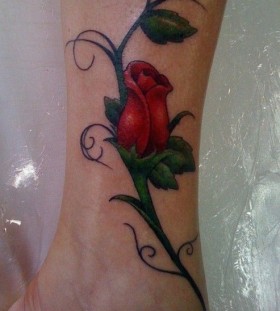 Red lovely rose tattoo on leg