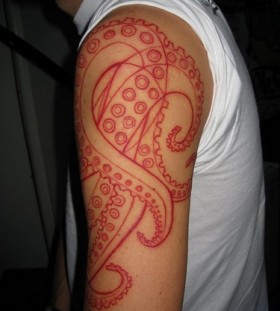 Red octupus tattoo on hand