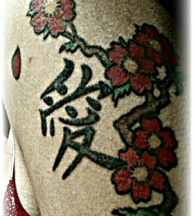 Red pretty cherry tattoo on arm