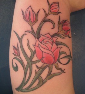 Red pretty rose tattoo on arm