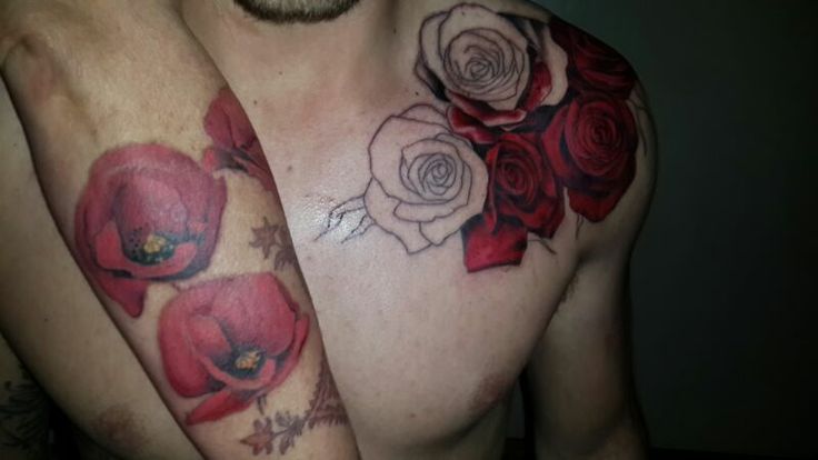 Red rose on shoulder and red poppy tattoo on arm