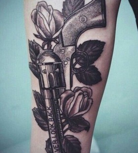 Red roses and gun tattoo