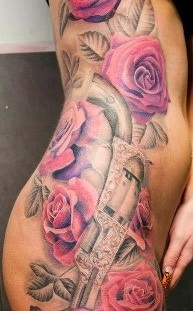 Red roses gun tattoo