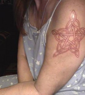 Red simple women star tattoo on shoulder