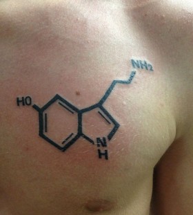 Serotonin tattoo on man breast