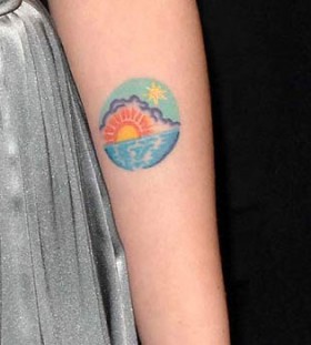 Sexy colorful sun tattoo on arm