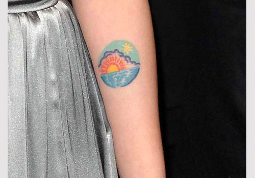 Sexy colorful sun tattoo on arm