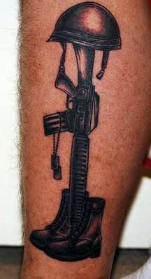 Shoes, helmet and gun soldier tattoo on arm