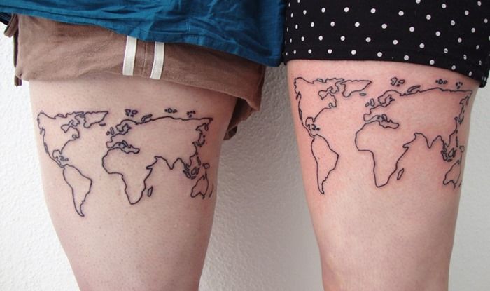 Simmiliar world maps tattoo on legs