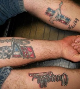 Simple arm and colored car tattoo on leg