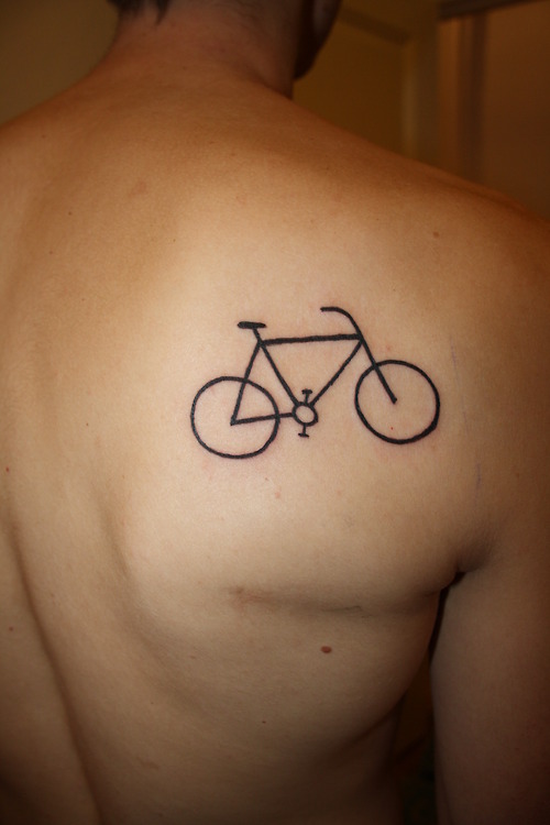 Simple black bicycle tattoo on back