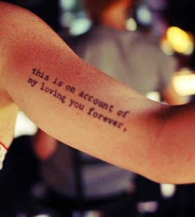 Simple black quote tattoo on arm