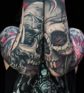 Simple black skull tattoo on shoulder