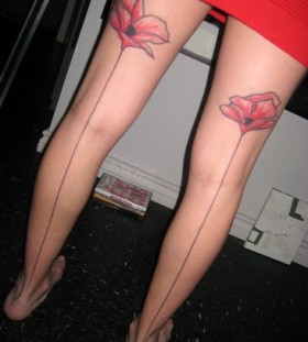 Simple girl poppy tattoo on legs