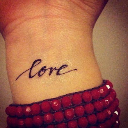 Simple pretty love tattoo on arm
