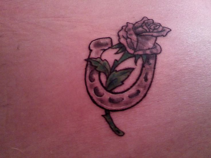 Simple rose and horse shoe tattoo