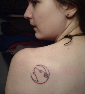 Simple women's back moon tattoo