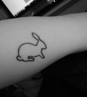 Small contures of rabbit tattoo on arm