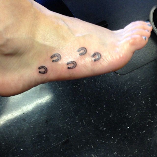 Small foots horse shoe tattoo