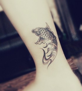Small koi fish tattoo on leg