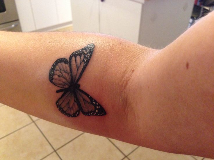 Small lovely butterfly tattoo on arm
