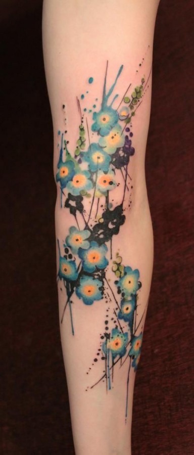 Small pretty blue flowers tattoos