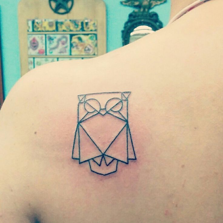 Smart owl origami tattoo on shoulder