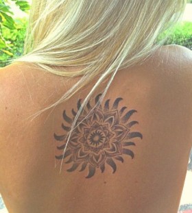 Smiling lovely back sun tattoo