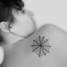 Spider net tattoo on girl back