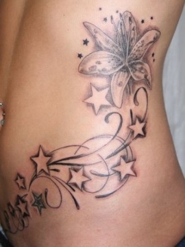 Stars and flowers hawaiian style tattoo