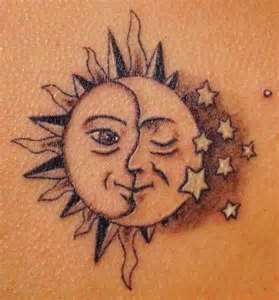 Stars and yellow moon tattoo on shoulder