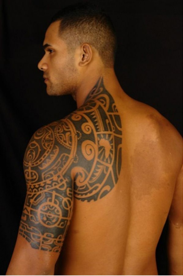 Strong men’s tribal tattoo on shoulder