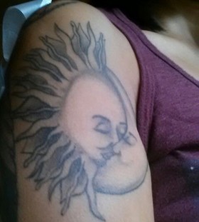 Sun and lovely moon tattoo on shoulder