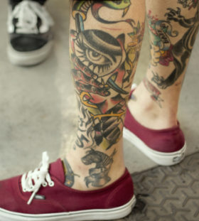 Traditional men's eye tattoo on leg