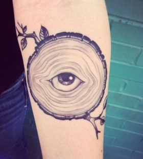 Tree and amazing eye tattoo on arm