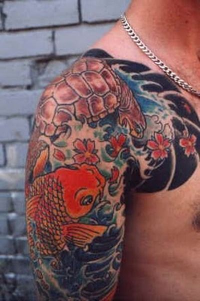 Turtle and lovely red fish tattoo on arm