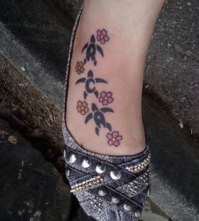 Turtles and small flowers hawaiian style tattoo
