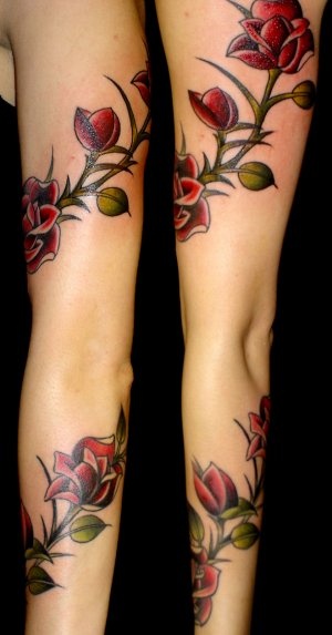 Unique red rose tattoo on leg