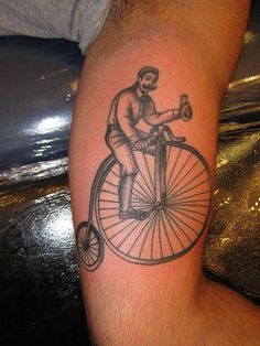 Vintage bicycle tattoo on leg