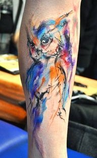 Watercolor owl bird tattoo on arm