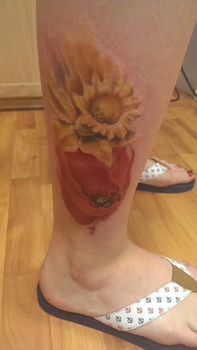 Poppies tattoos on legs