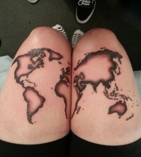 White and black map tattoo on legs