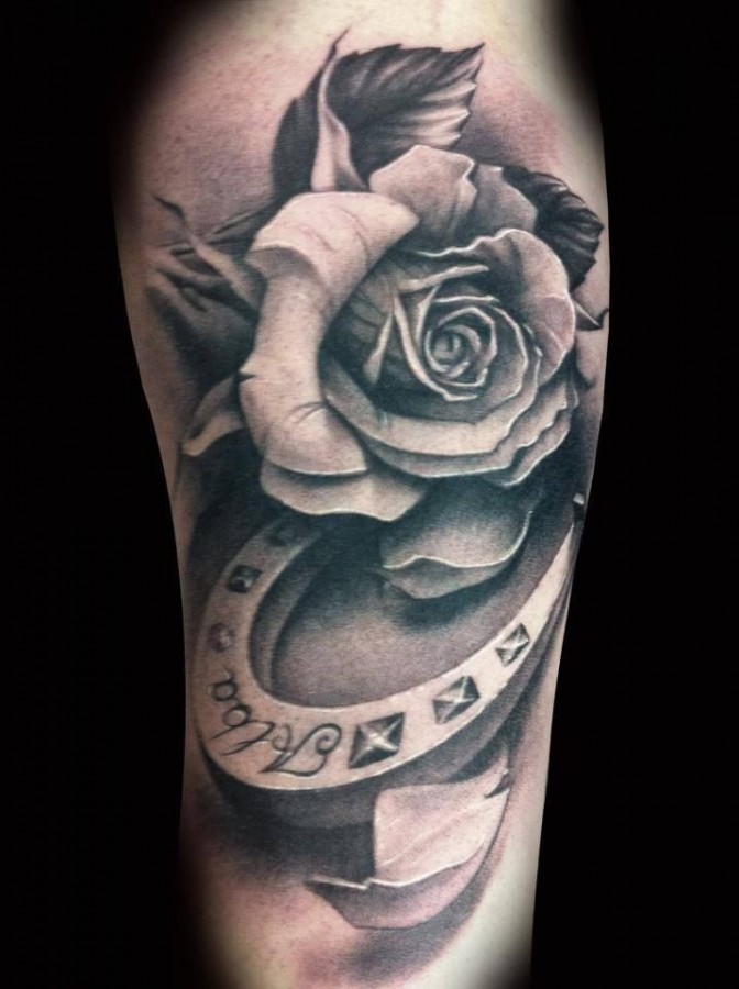 White black rose and horse shoe tattoo