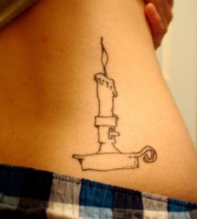 White candle and back book tattoo