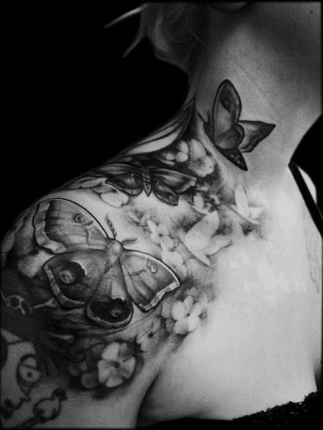 Women black and white shoulder butterfly tattoo on arm