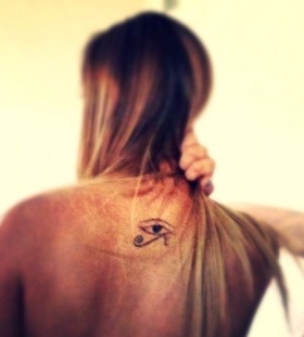 Women's back eye tattoo on shoulder