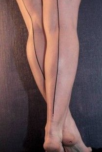Women's lovely line tattoo on leg