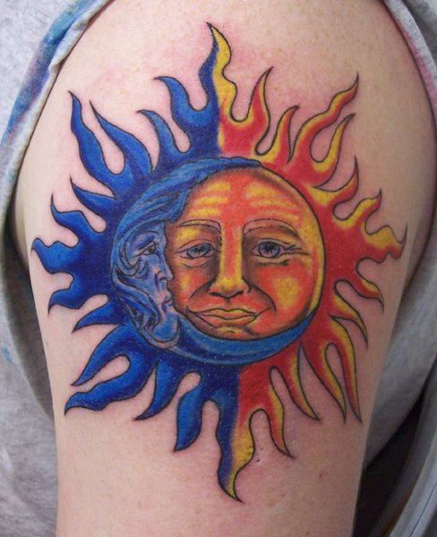 Yellow sun and blue moon tattoo on shoulder