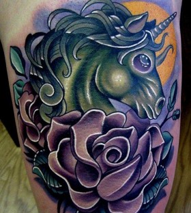 green unicorn tattoo with rose