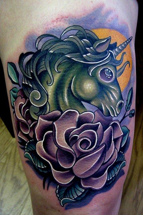 green unicorn tattoo with rose